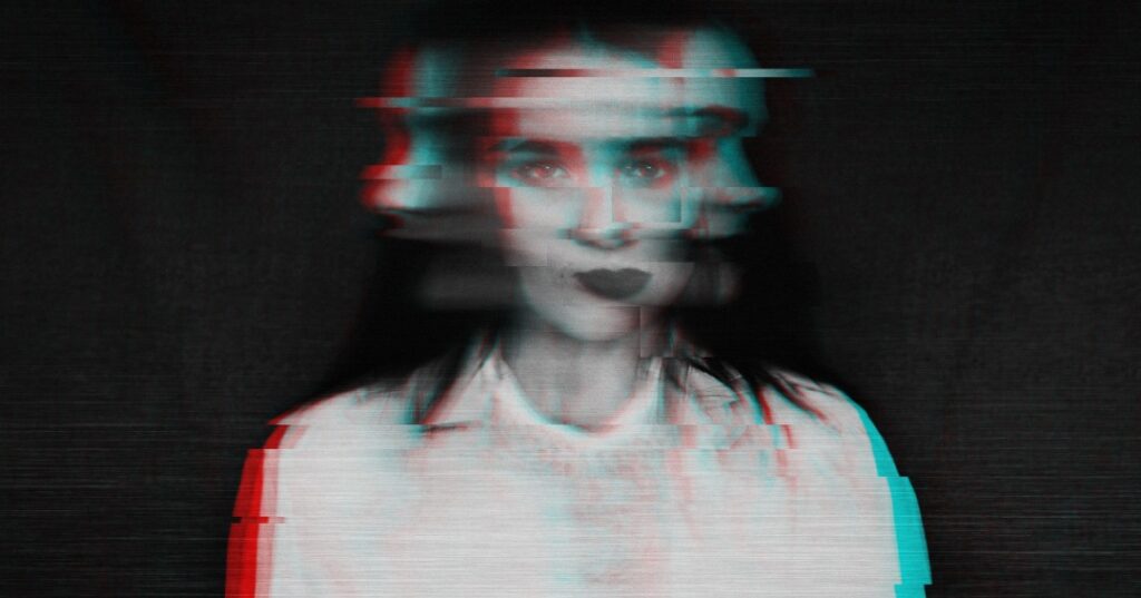 black and white blurred abstract portrait of a girl with mental disorders and schizophrenia with a glitch effect